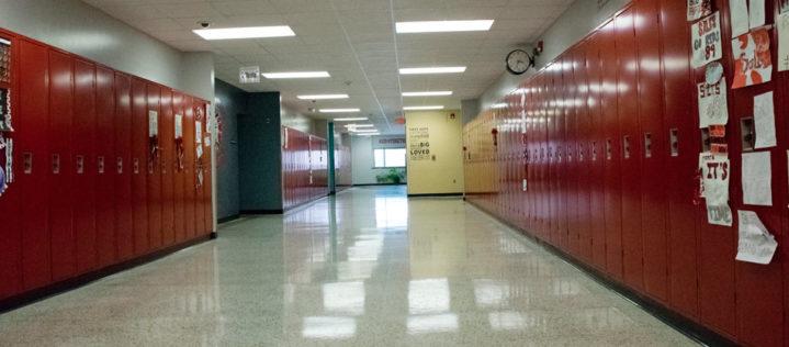 Centerville High School empty hallway with red lockers