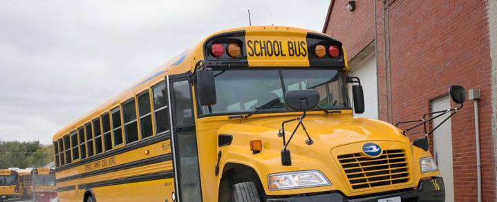 Yellow school bus getting washed outside